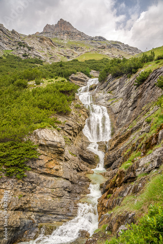View at the Braulio Waterfall on the road to Stelvio Pass - Italy photo