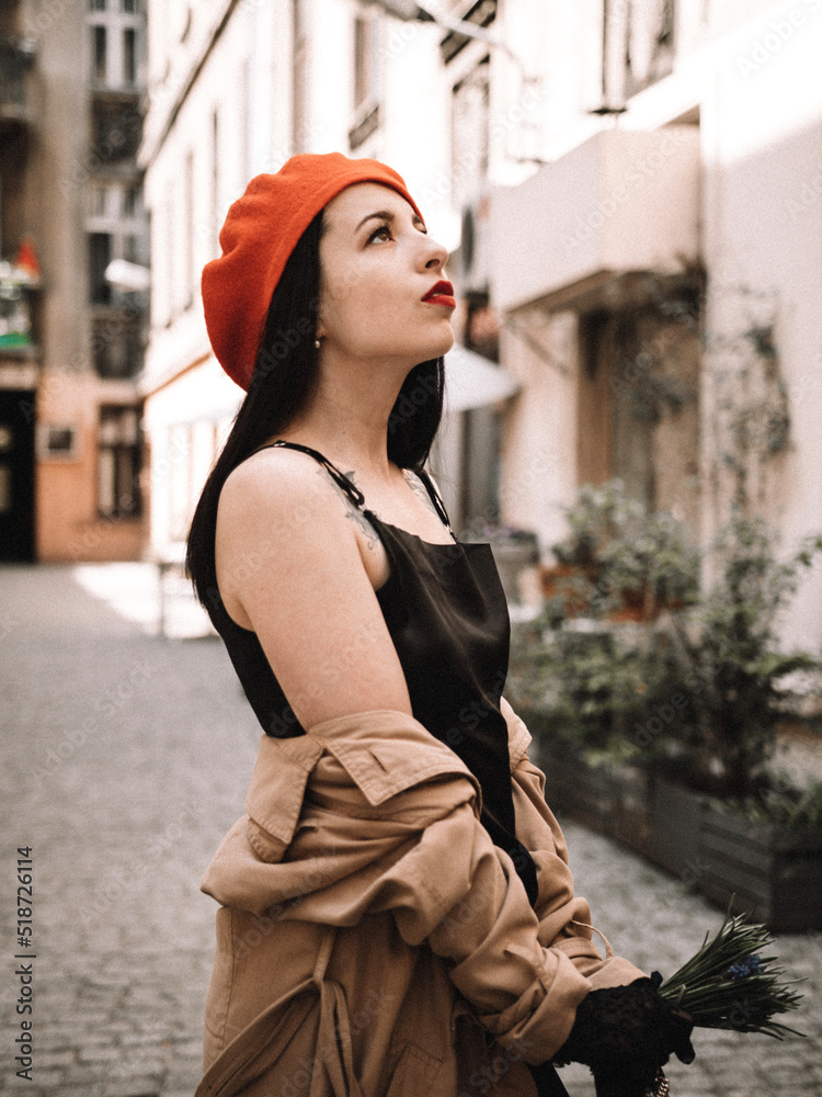 A girl in a coat and beret in the French style A girl in a coat and beret in the French style