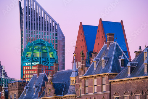 The Hague, Netherlands. A cityscape in the evening. View of historical buildings and modern business center. Reflections in the water. Architecture and design in the Netherlands..