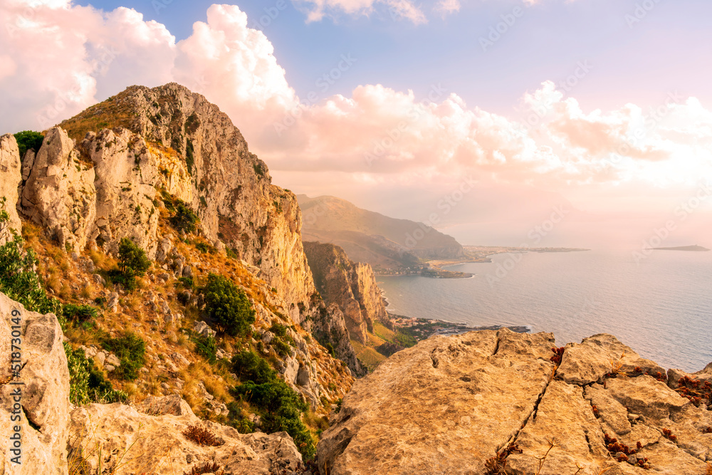 Fototapeta premium amazing panoramic view from a high rock to sunset or sunrise sea in evening or morning with coastline