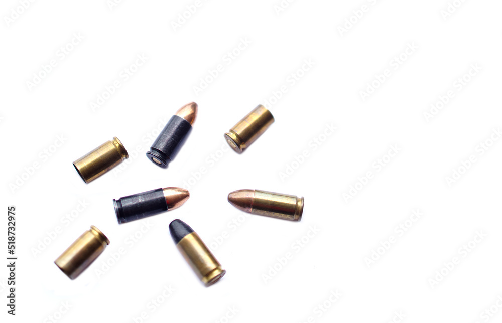 9mm pistol gun bullets and cartridge cases isolated on white background. Flat lay. Space for text. Concept : dangerous weapon for shooting. 9mm pistol gun bullets and cartridge cases isolated on white background. Flat lay. Space for text. Concept : dangerous weapon for shooting.
