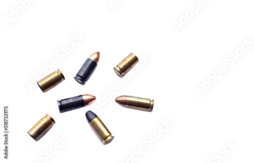 9mm pistol gun bullets and cartridge cases isolated on white background. Flat lay. Space for text. Concept : dangerous weapon for shooting. 