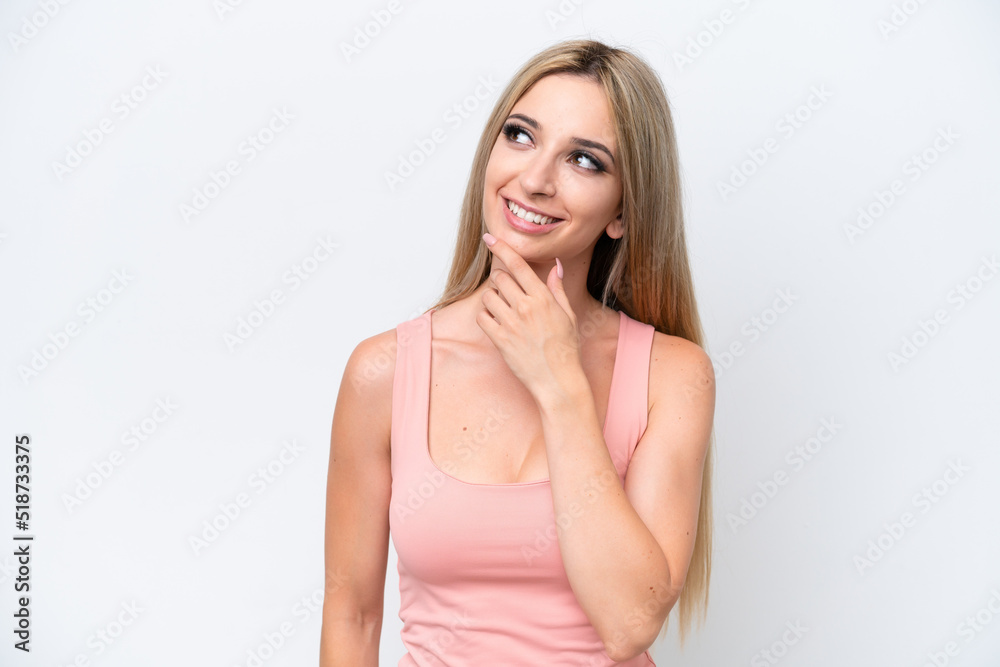 Pretty blonde woman isolated on white background looking up while smiling Pretty blonde woman isolated on white background looking up while smiling
