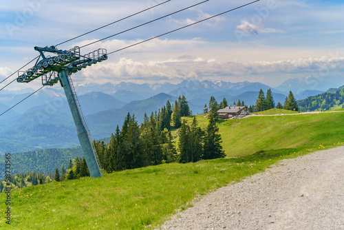 Beautiful alpine summer view with a ropeway pylon at the famous Brauneck summit near Lenggries, Bavaria, Germany