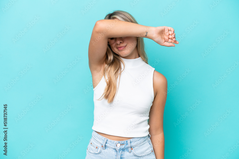 Young caucasian woman isolated on blue background covering eyes by hands Young caucasian woman isolated on blue background covering eyes by hands