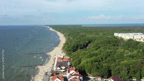 Curonian Spit wth Baltic sea coastline on sunset. Kurshskaya kosa national park near Zelenogradsk. Kaliningrad region. Aerial view photo