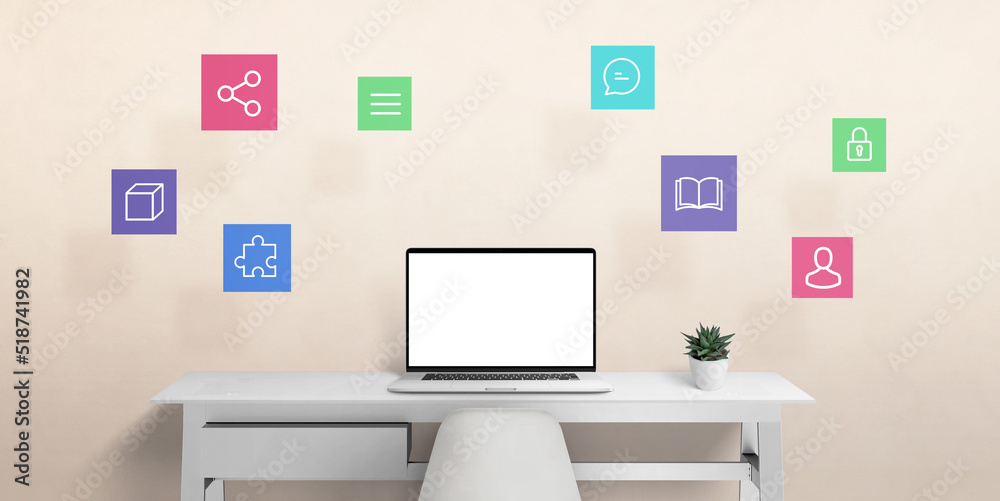 Laptop computer on work desk with internet of things icons in air. Isolated screen for mockup, web page presentaiton Laptop computer on work desk with internet of things icons in air. Isolated screen for mockup, web page presentaiton