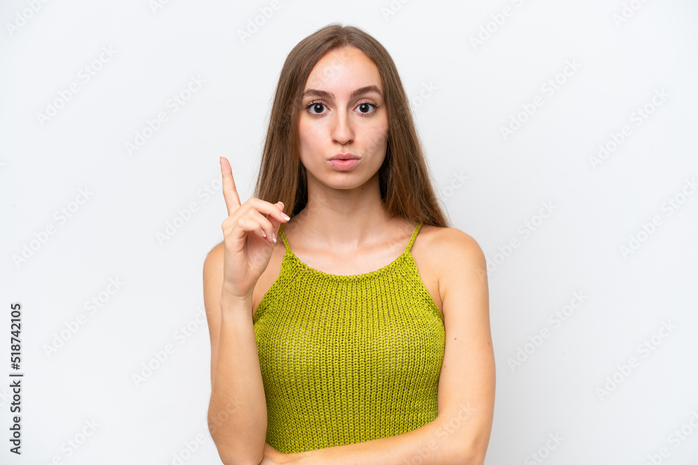Fototapeta premium Young caucasian woman isolated on white background intending to realizes the solution while lifting a finger up