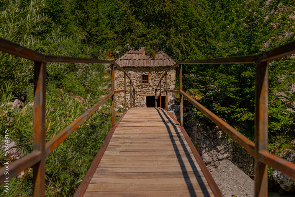 Bridge to popular tourist attraction in Valbona valley, Albania, a Mulliri i Vjeter old mill house. Bridge leading to the mill in poor condition.