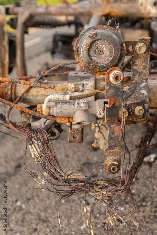 Newburn England: 16.06.2022: stolen motorbike set on fire burned out and abandoned on industrial estate Road with green trees