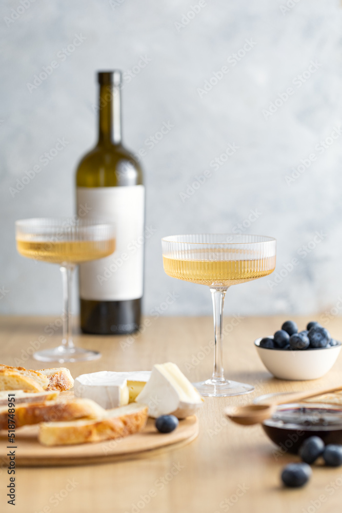 Still-life with bunch of cheese, berry and white wine, copy space Still-life with bunch of cheese, berry and white wine, copy space