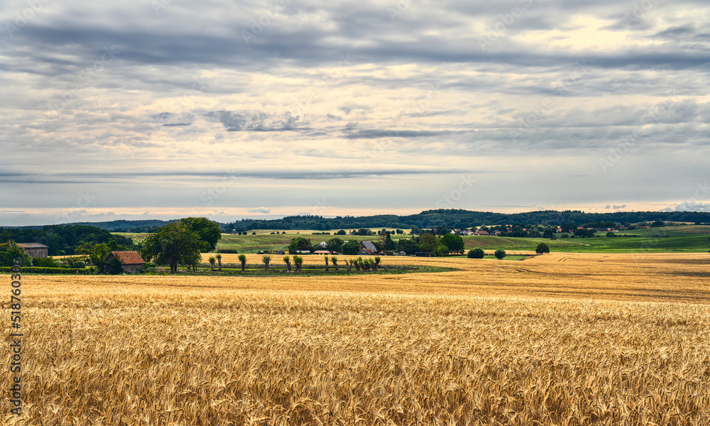 typical landscape with fields and houses in saxon switzerland, mecklenburg western pomerania