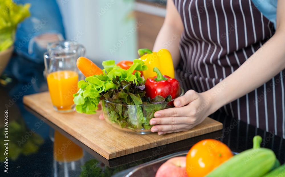 beautiful asian female at kitchen