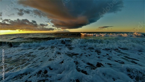 beautiful sea waves and cloudy sky during sunset time