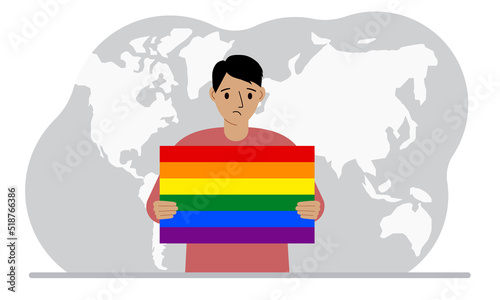 A man holds an lgbt flag in his hands against the backdrop of a world map.