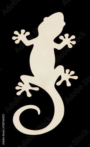 Gecko is made from plywood boards isolated on black background with clipping path