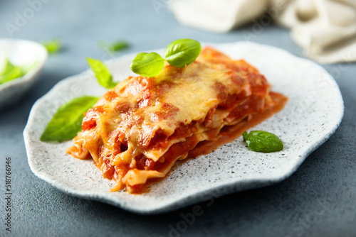 Traditional homemade lasagna with fresh basil 