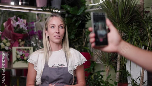 Beautiful girl teaching how to make perfect bouqet flower vase online workshop. Online, education business, flower shop