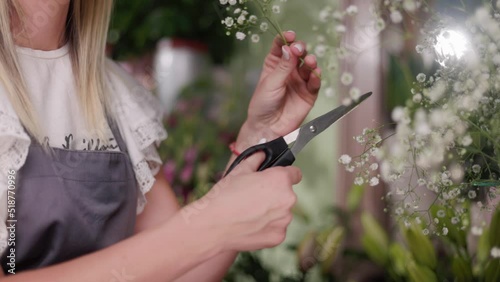Floral artist working in flower shop. Floristry creating flower arrangement. Small woman business concept, self employed.
