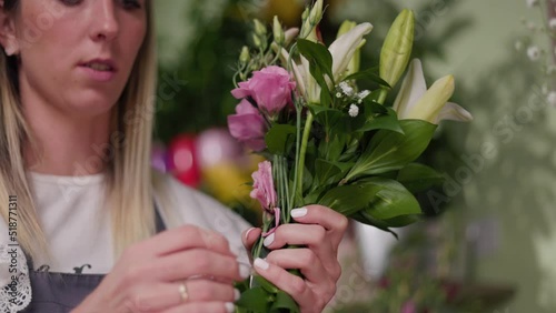 Floral artist working in flower shop. Floristry creating flower arrangement. Small woman business concept, self employed.
