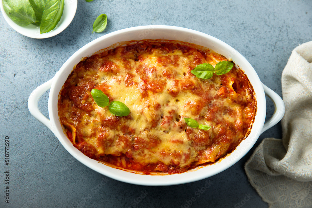 Traditional homemade lasagna with fresh basil Traditional homemade lasagna with fresh basil