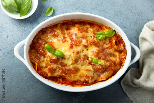 Traditional homemade lasagna with fresh basil 