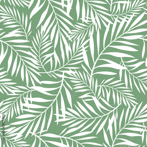 Green and white floral seamless pattern with palm leaves. Vector tropical background © naddya