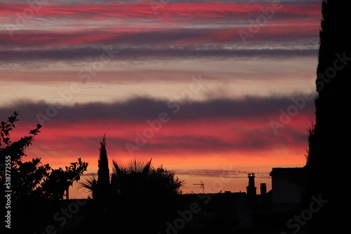 pink clouds of a sunset over the city