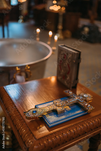 Obraz na plátne the baptismal cup is filled with water in the church, candles are burning, the l