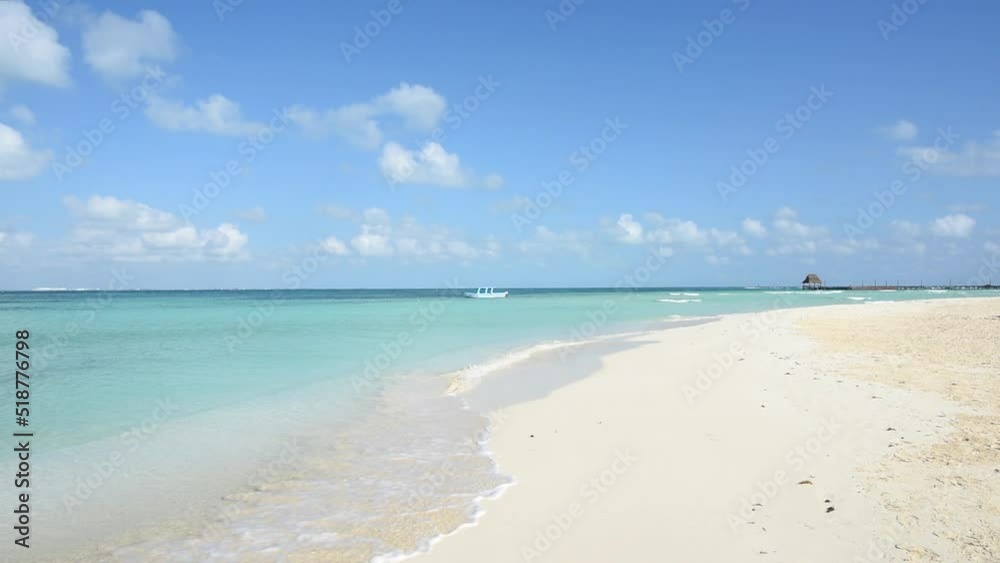 Deserted tropical beach at sunrise with a boat anchored against the blue sky, Isla Mujeres, Mexico. Horizontal HD video Deserted tropical beach at sunrise with a boat anchored against the blue sky, Isla Mujeres, Mexico. Horizontal HD video