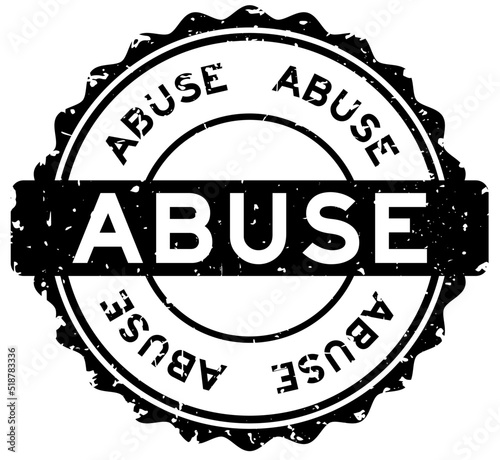 Grunge black abuse word round rubber seal stamp on white background