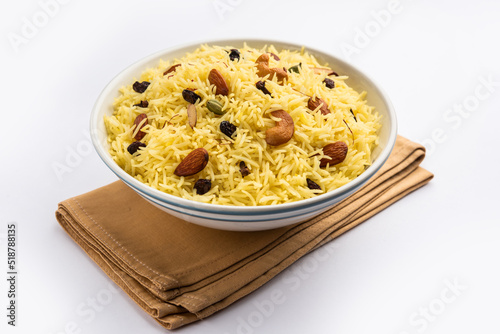Kashmiri sweet modur pulao made of rice cooked with sugar, water flavored with Saffron and dry fruits photo