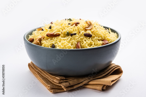 Kashmiri sweet modur pulao made of rice cooked with sugar, water flavored with Saffron and dry fruits photo