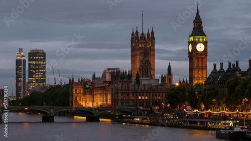 London, UK. Video time-lapse of cloudy sky over the city of London, UK. Westminster and Big Ben during the evening, panning video