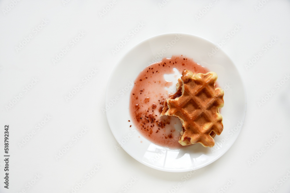 Viennese waffles with jam on a white plate. Delicious sweet breakfast with waffle. Viennese waffles with jam on a white plate. Delicious sweet breakfast with waffle.