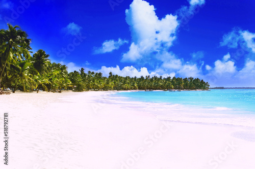 The Saona Island in sunny weather. Clean and deserted beach with white sand.