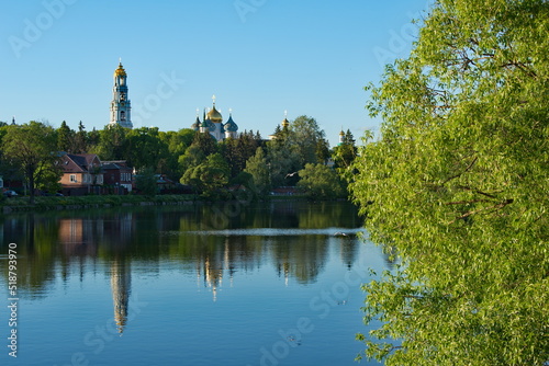 Sergiev Posad. Russia. Reflection in the waters of the Kelarsky Pond of the Bell tower and domes of the Assumption Cathedral of the Trinity-Sergius Lavra.