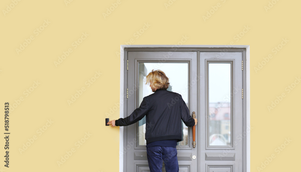 Man opening the door of her home.Inviting the guests