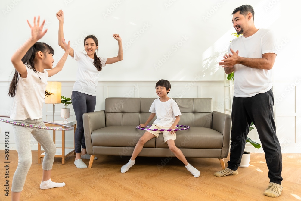 Naklejka premium Young asian parents with child meditating at home isolated in room. Family, sport, yoga concept.