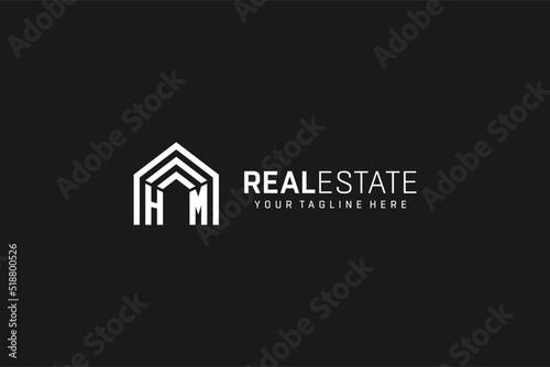 Letter HM house roof shape logo, creative real estate monogram logo style