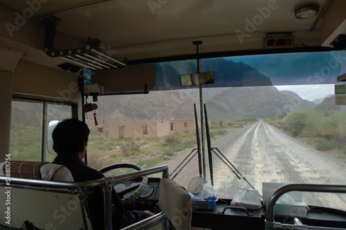 Man driving bus in tough desert terrain