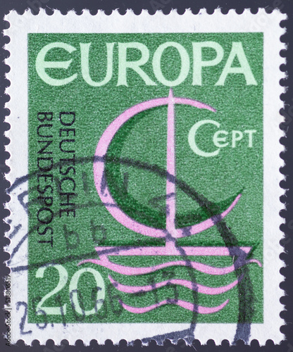 GERMANY - CIRCA 1966: a postage stamp from GERMANY, showing a boat with sails and waves and graphics with the letters CEPT formed. Text : EUROPE. Circa 1966