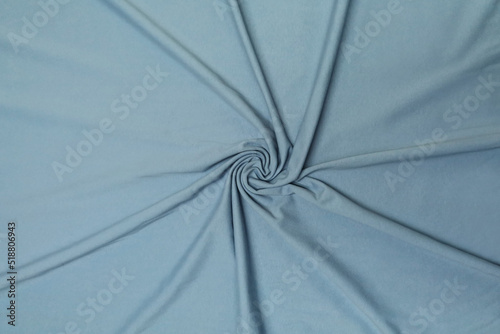 Fototapeta Naklejka Na Ścianę i Meble -  Blue footer fabric crumpled or wavy fabric texture background. Abstract linen cloth soft waves. Merino yarn. Smooth elegant luxury cloth texture. Concept for banner or advertisement.