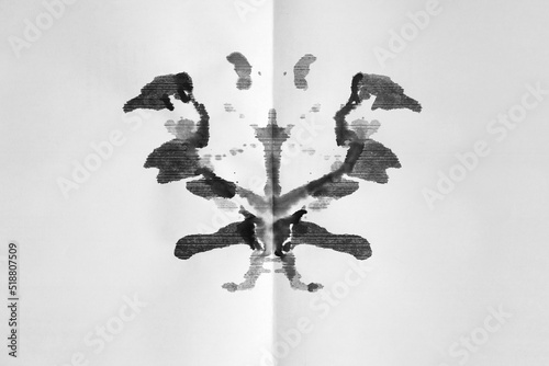 Abstract ink blot test - Rorschach test used in Psychoanalysis. Symmetric shapes, granulated ink isolated against white background