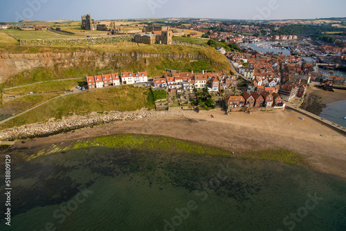 Whitby Abbey was a 7th-century Christian monastery that later became a Benedictine abbey. Whitby, Yorkshire seaside town  resort and fishing port  photo