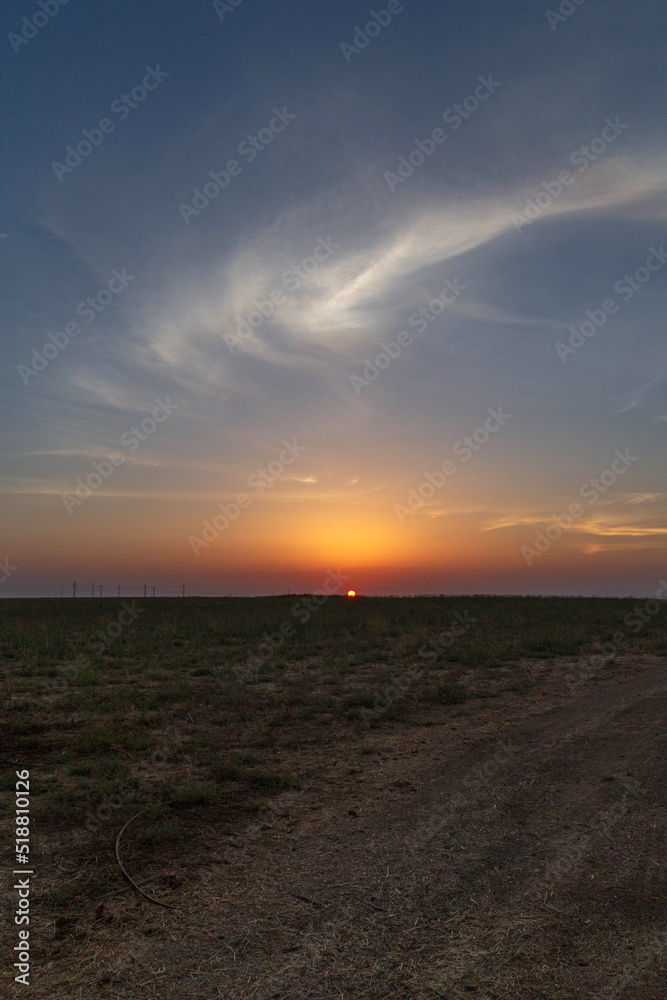 Beautiful sunset in the field. Israel. Hot summer evening. Beautiful sunset in the field. Israel. Hot summer evening.