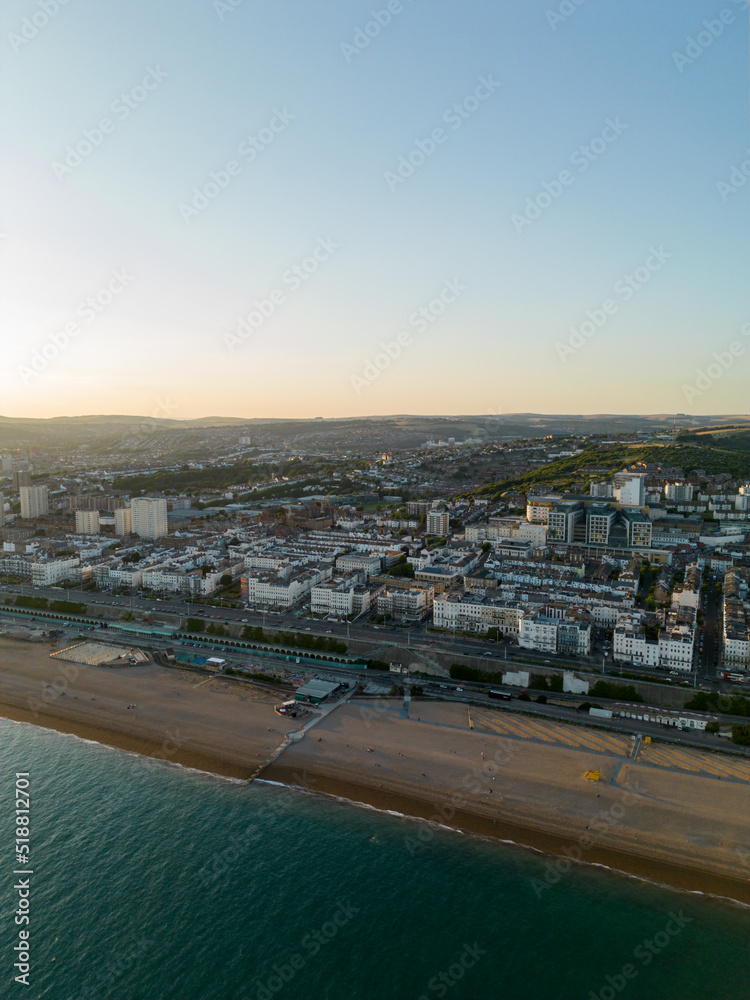 Fototapeta premium Vertical aerial photo sunset over Brighton Beach UK