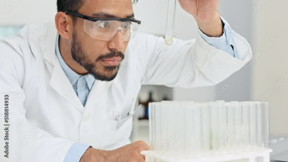 Scientist analyzing medical samples for an experiment in a bright laboratory. Focused health care professional creating a cure with modern medicine and technology. Innovation in modern science Scientist analyzing medical samples for an experiment in a bright laboratory. Focused health care professional creating a cure with modern medicine and technology. Innovation in modern science