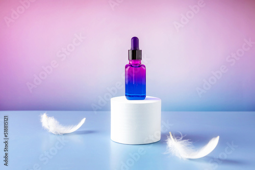  bottle with an essential oil pipette on a white round podium and falling feathers on a colored gradient background