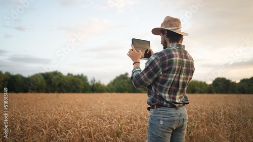Farmer working with tablet computer on wheat field © Big Shot Theory